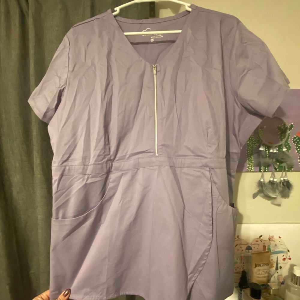 Size XL Uniform Advantage Butter Soft Peplum scrub top in Lavender.